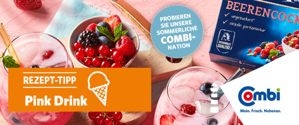 Rosafarbener Tisch mit einer halben Kokosnuss, diversen Früchten und zwei Coktails dazu eine Packung Küstengold Beerencocktail